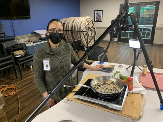 Pictured is Ashley recording a virtual cooking demonstration about instant brown rice recipes for clients served through Homage Senior Services.